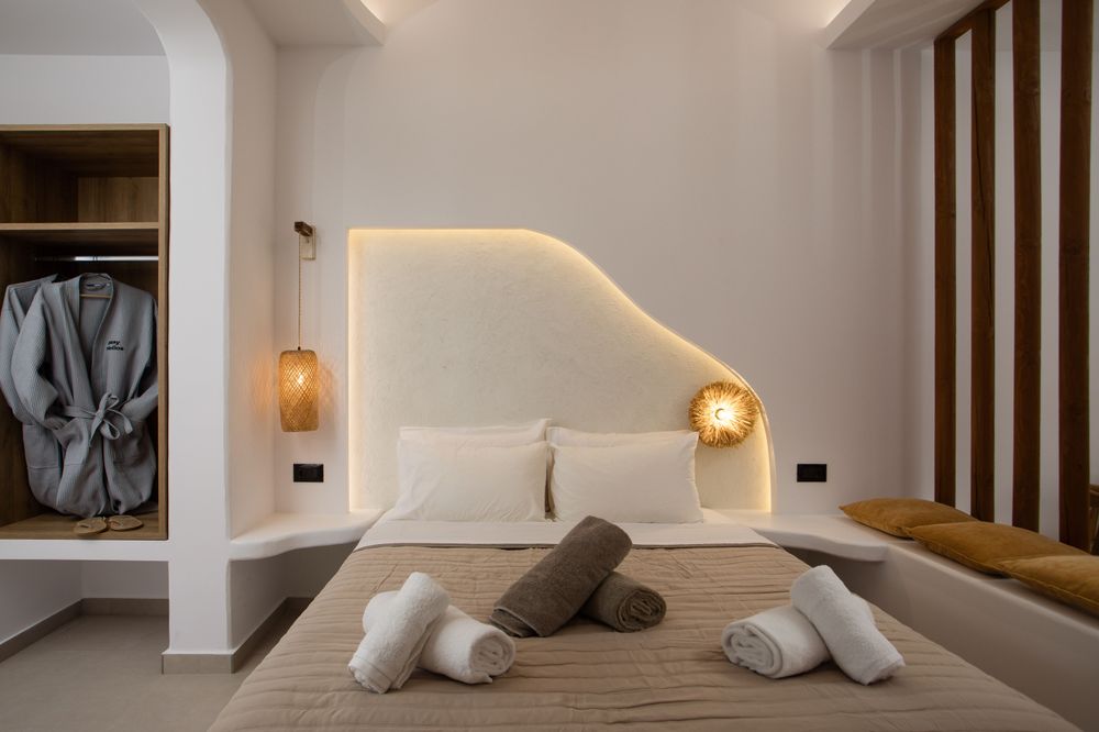 Modern-industrial lines softened by Mediterranean warmth.
